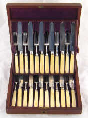 Appraisal: A set of twelve pairs of silver plated fruit knives