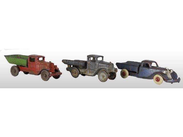 Appraisal: Lot of Cast Iron Dump Truck Toys Description Hubley Studebaker