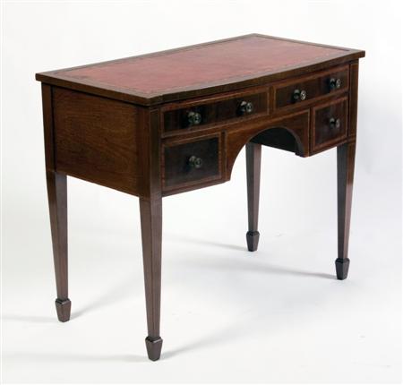 Appraisal: A Georgian style mahogany knee-hole desk the bowfronted top with