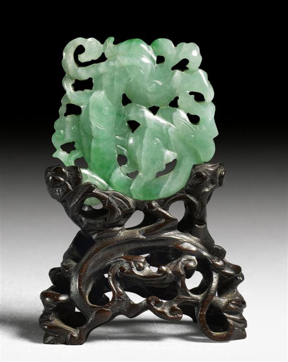 Appraisal: A JADEITE OPENWORK PENDANT SHOWING A DRAGON ON ONE SIDE