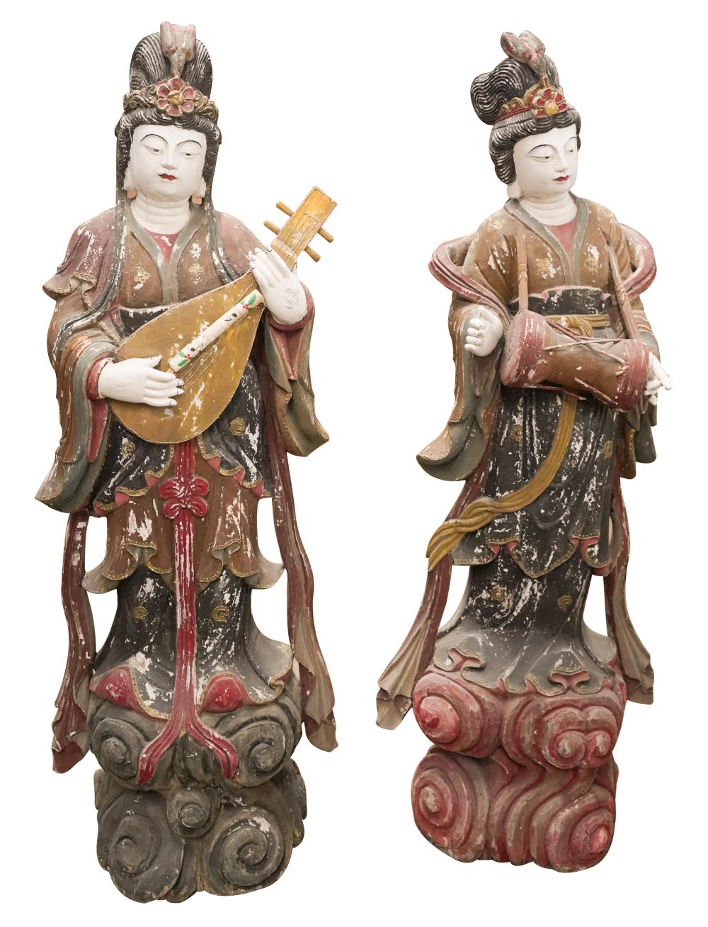 Appraisal: PAIR OF ASIAN PAINTED CARVED WOOD FIGURESCondition cracking to hands