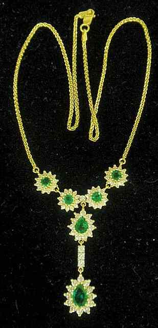 Appraisal: Emerald diamond and k yellow gold necklace- one pear shaped