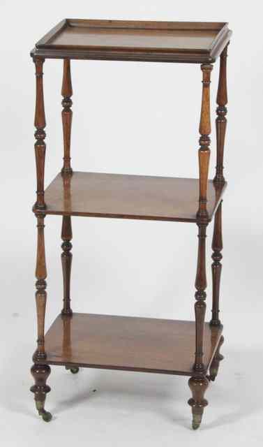 Appraisal: A small Victorian rosewood three-tier whatnot with turned supports cm