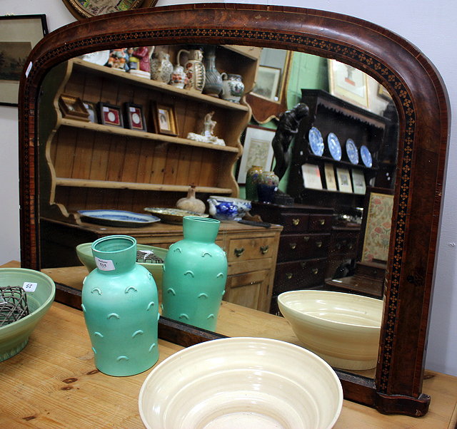 Appraisal: A VICTORIAN WALNUT AND INLAID OVERMANTLE MIRROR with arching plate