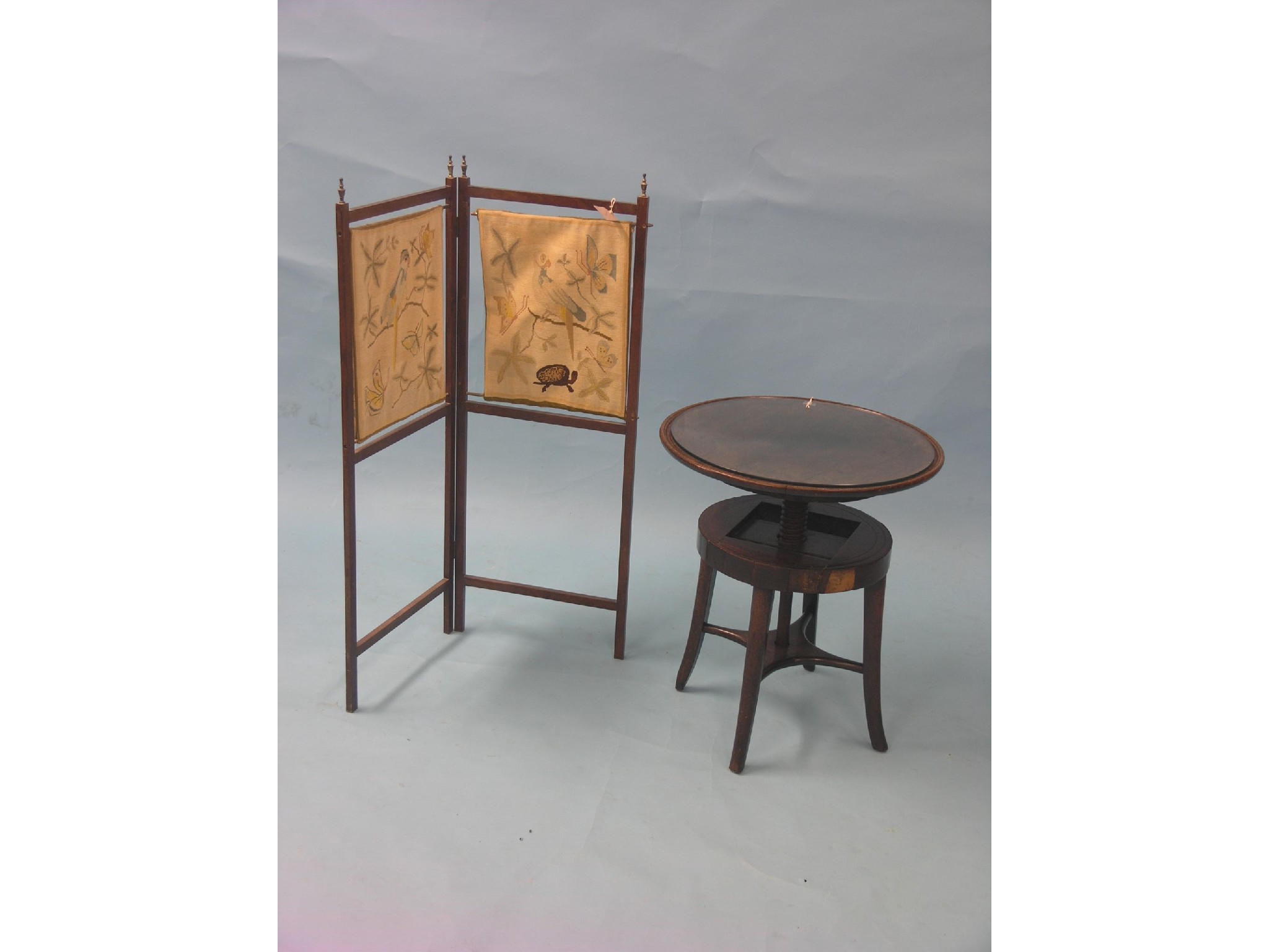 Appraisal: A mahogany wine table with revolving circular top ft in