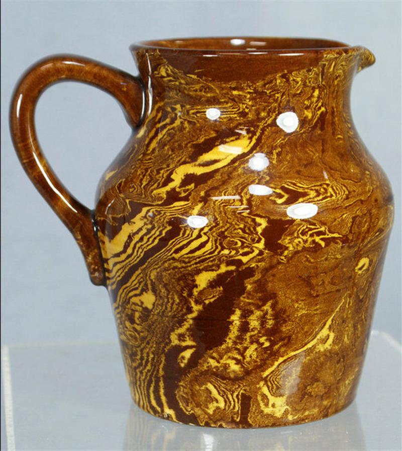 Appraisal: Kensington Pottery swirled mocha design pitcher underglaze stamp h Estimate