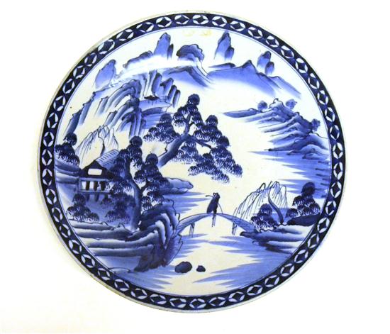 Appraisal: Oriental porcelain charger blue and white landscape with figure on