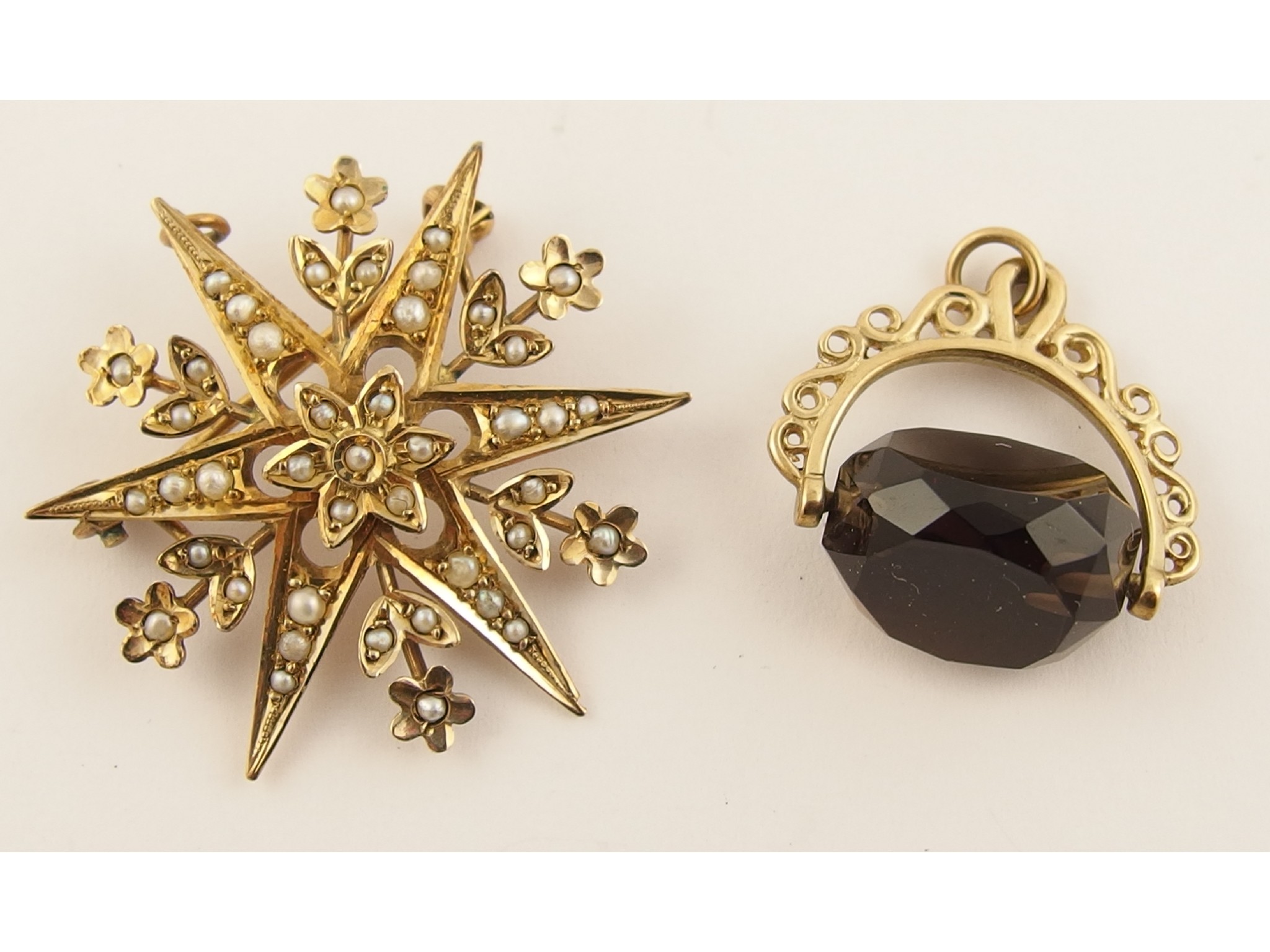 Appraisal: A ct pearl set star pendant brooch and a ct