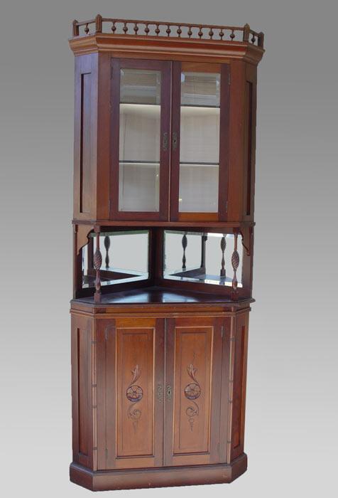 Appraisal: DELICATE VICTORIAN EASTLAKE STYLE CORNER CUPBOARD Double beveled glass door