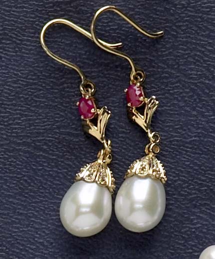 Appraisal: PEARL EARRINGS k yellow gold dangling pierced earrings set with