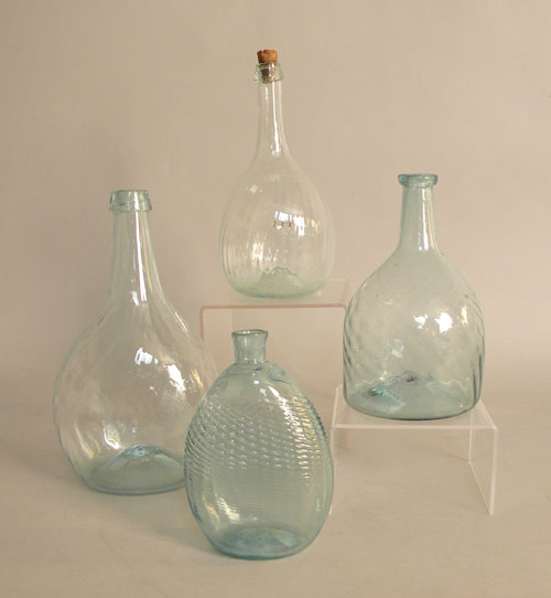 Appraisal: Three blown aqua glass bottles together with a pitkin type