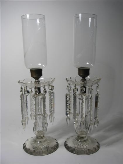 Appraisal: Pair glass candlesticks with prisms and hurricane shades Total H