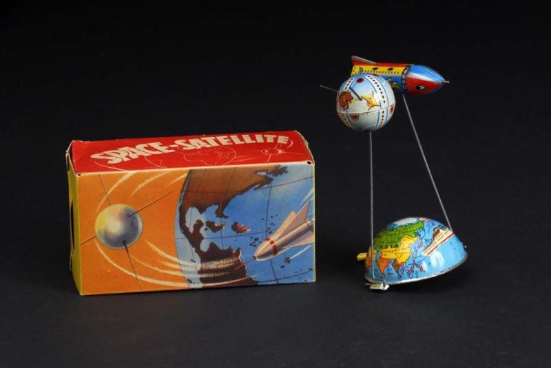 Appraisal: Tin Space Satellite Lever-Activated Toy Description German Beautiful lithography with