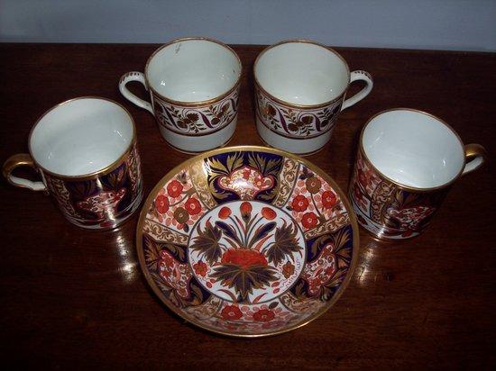 Appraisal: Two Coalport th Century coffee cans and a saucer decorated