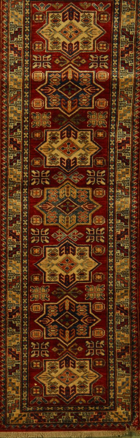 Appraisal: ORIENTAL RUG KAZAK-DESIGN RUNNER ' x ' Seven star-shaped medallions