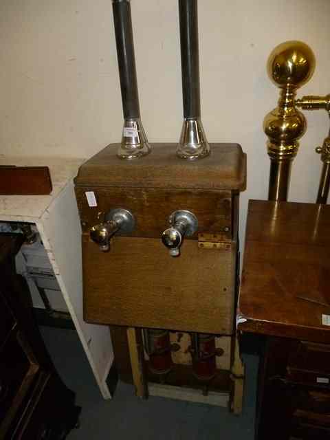 Appraisal: A PAIR OF GASKELL CHAMBERS BEER PUMPS and partial oak