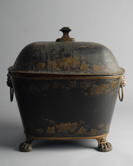 Appraisal: A Toleware Coal Hod with lift lid paw feet and