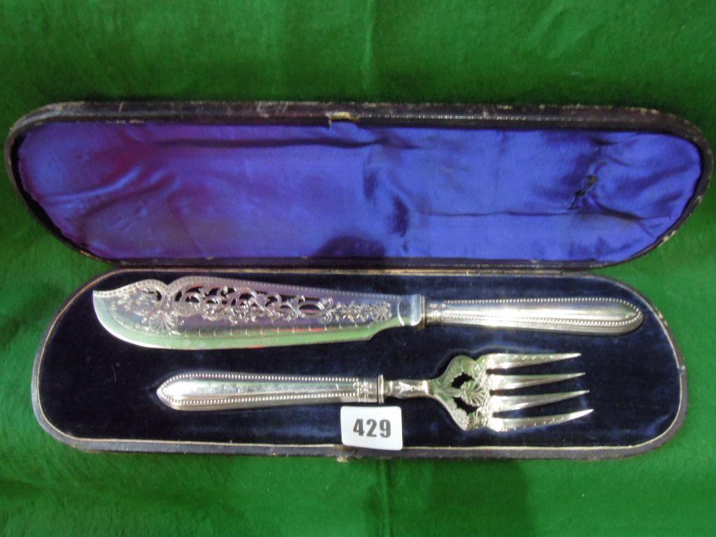 Appraisal: A Victorian silver fish serving set with pierced and scrolled