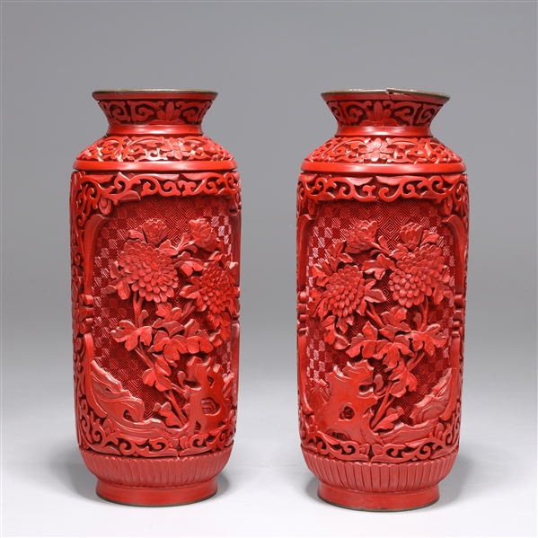 Appraisal: Pair of Chinese red lacquer like vases each with elaborate