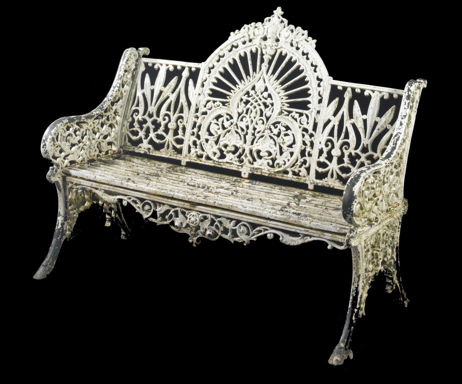 Appraisal: A CAST-IRON GARDEN SEAT the back centred by an arabesque