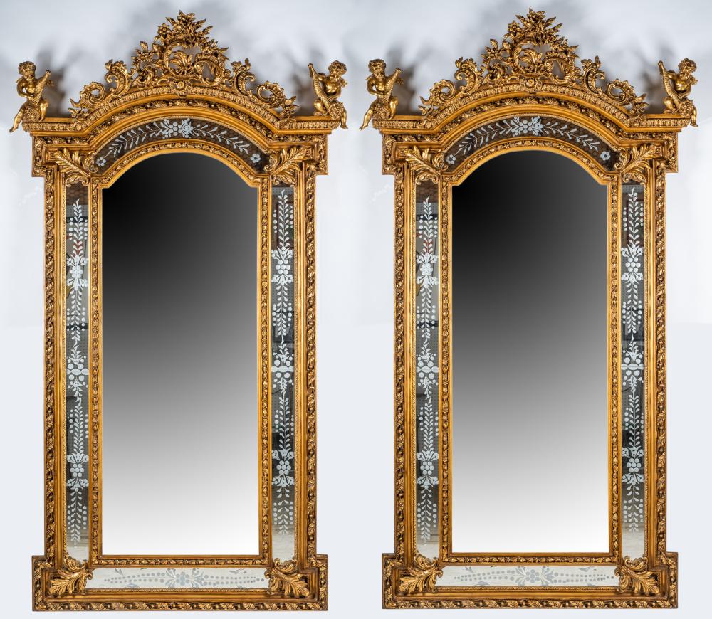 Appraisal: PAIR OF LARGE FIGURAL GILT WALL MIRRORSeach with etched glass