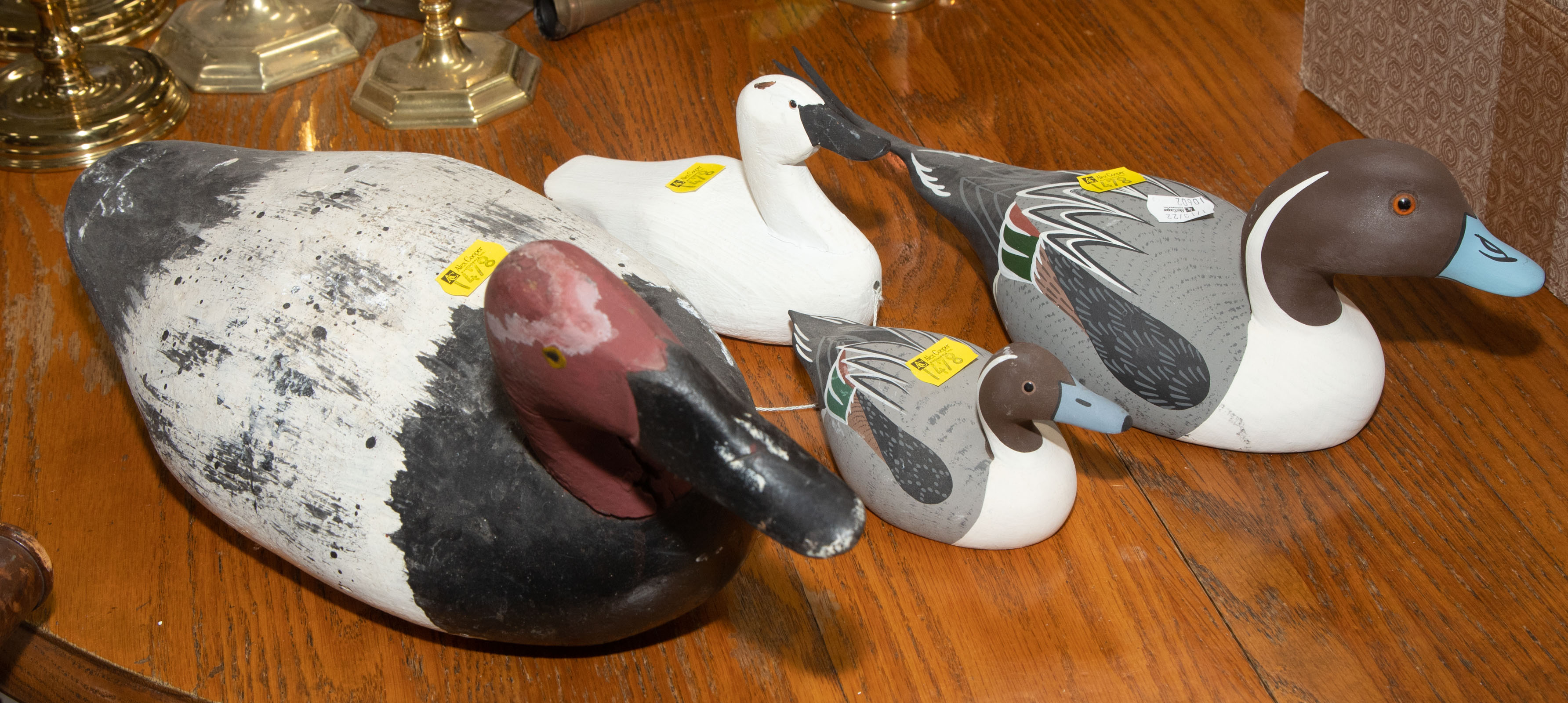 Appraisal: FOUR CARVED PAINTED WOOD DUCKS Includes two small pintails by