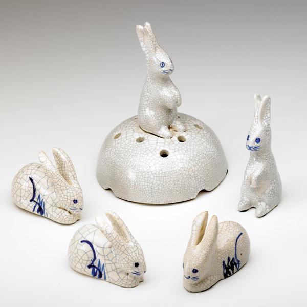 Appraisal: DEDHAM Crackleware five Rabbit figurines a flower holder three knife