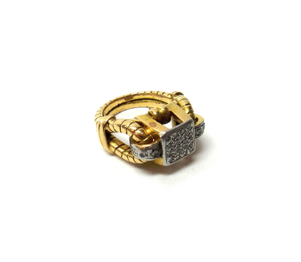 Appraisal: A gold and diamond set ring in a square panel