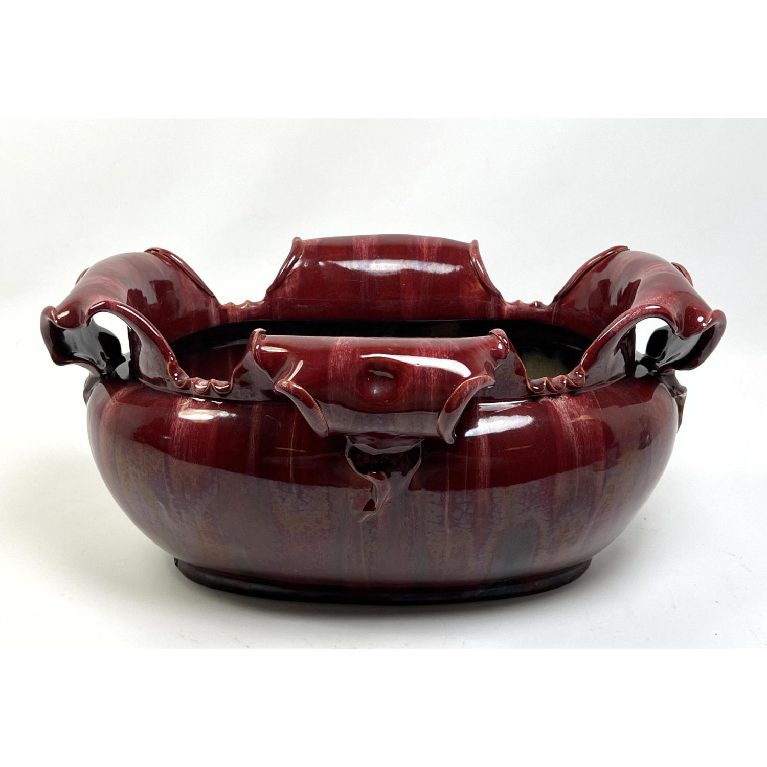 Appraisal: Red Glazed Art Pottery Bowl Austrian style with organic rolled