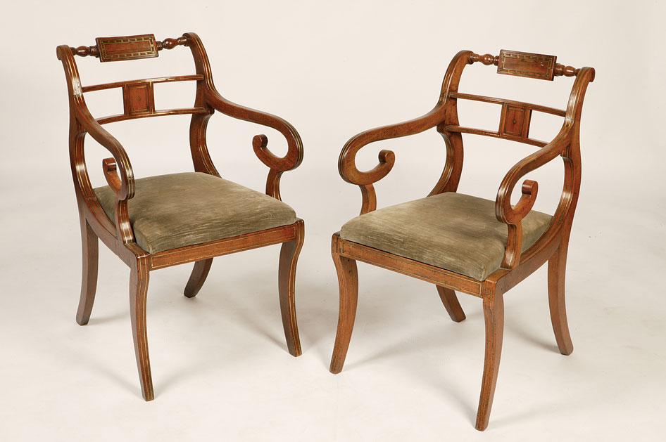 Appraisal: A PAIR OF REGENCY STYLE MAHOGANY AND BRASS INLAID ARMCHAIRS