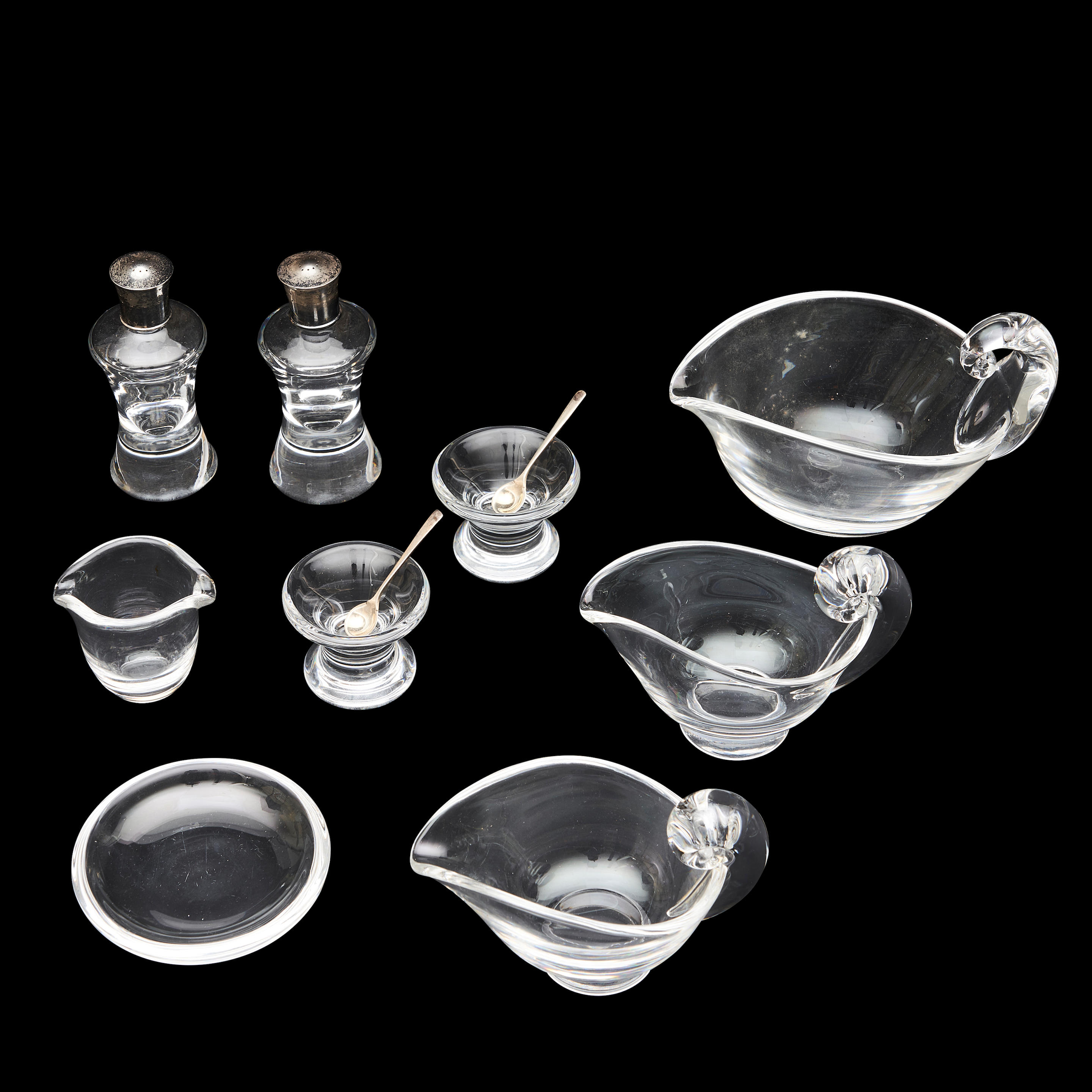 Appraisal: NINE PIECES OF STEUBEN COLORLESS GLASS TABLEWARE including two creamers