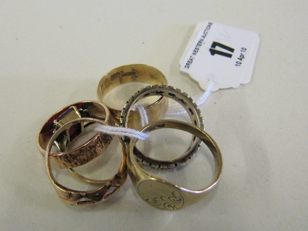 Appraisal: Five ct gold rings and a silver and gold eternity