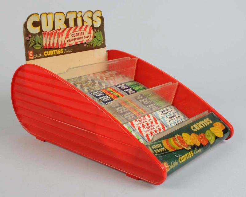 Appraisal: Curtiss Candy Plastic Display Rack This Curtiss candy rack has