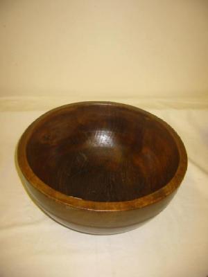 Appraisal: AN ELM DAIRY BOWL the deep sides with inscribed line