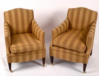 Appraisal: A pair of armchairs upholstered in striped gold fabric on