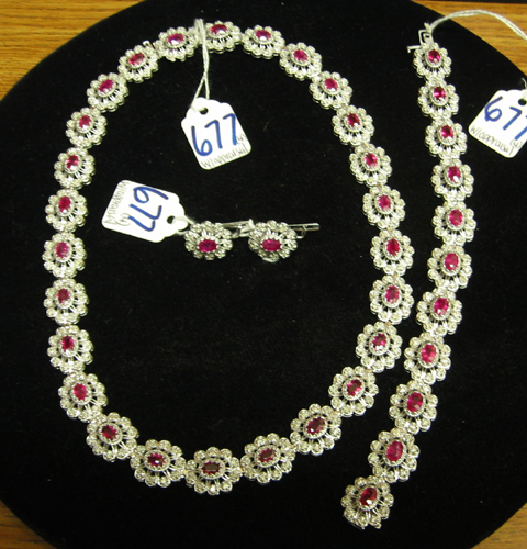 Appraisal: RUBY DIAMOND AND FOURTEEN KARAT WHITE GOLD FOUR PIECE MATCHING