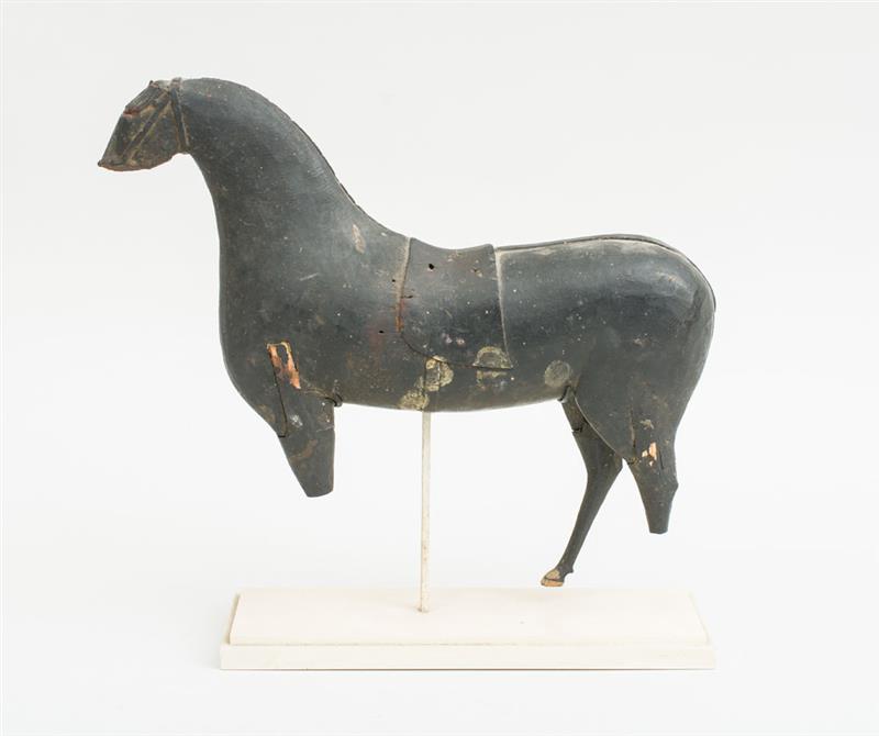 Appraisal: CARVED AND BLACK PAINTED WOOD MODEL OF A HORSE WITH