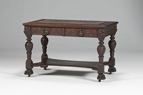 Appraisal: MAHOGANY CARVED LIBRARY TABLE early th century With carved lion's