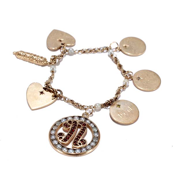 Appraisal: Gold K ID charm bracelet with large jeweled N initial