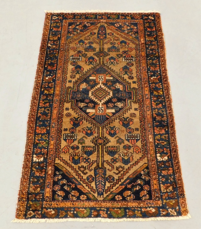 Appraisal: GEOMETRIC CAMEL HAIR HAMADAN CARPET Middle East th CenturyNavy and