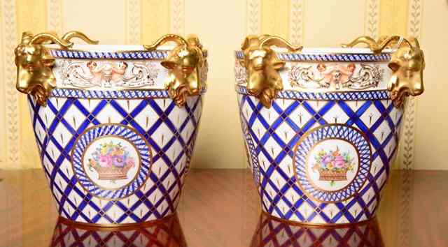 Appraisal: A PAIR OF DRESDEN PORCELAIN WINE COOLERS with gilt rams