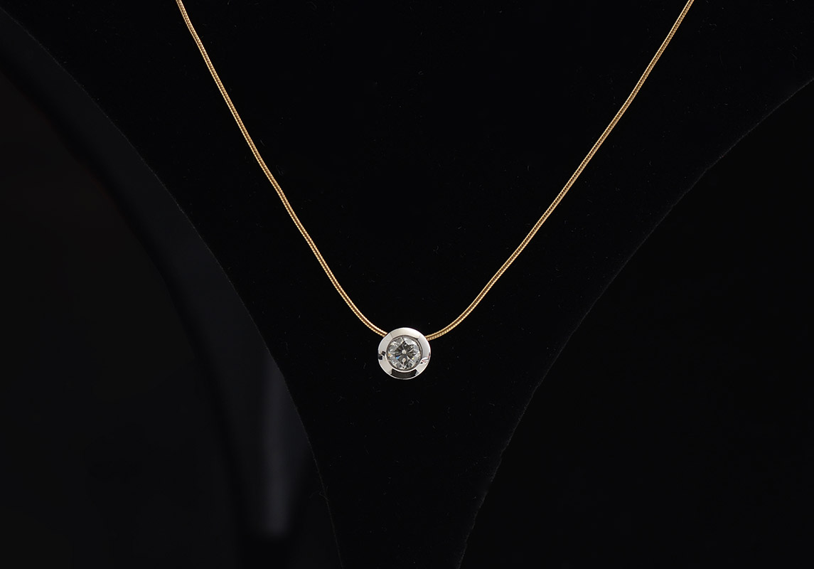 Appraisal: BAILEY BANKS BIDDLE BEZEL SET DIAMOND PENDANT K CHAIN Simple