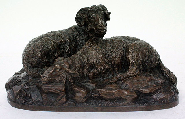 Appraisal: A BRONZE MODEL OF A RAM AND A SHEEP ON