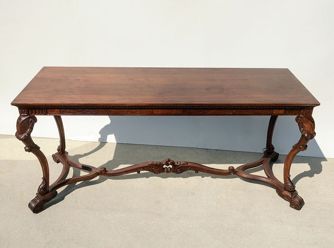 Appraisal: CARVED FOYER SOFA TABLE Elongated rectangular top shaped supports with