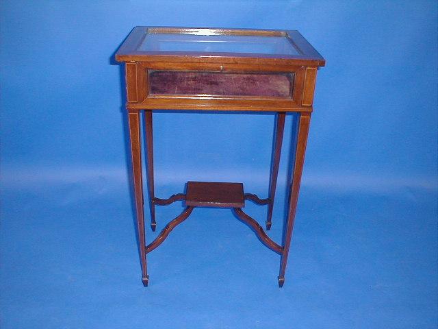 Appraisal: An Edwardian string inlaid mahogany bijouterie table cabinet raised on