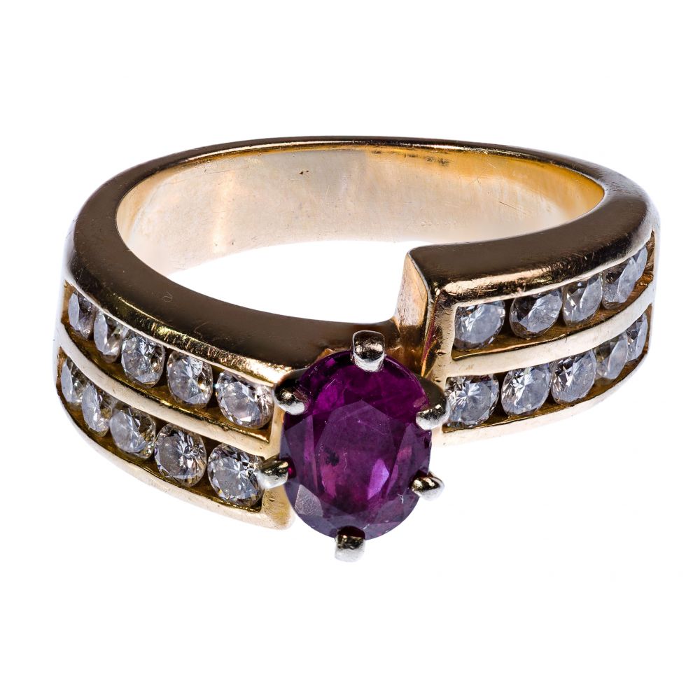 Appraisal: K YELLOW GOLD RUBY AND DIAMOND RINGHaving an oval cut