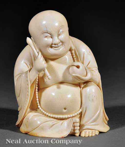 Appraisal: A Chinese Carved Ivory Figure of Budai the laughing rotund