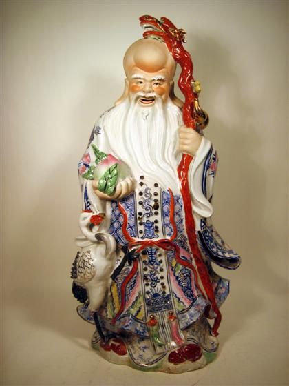 Appraisal: Large Chinese porcelain Immortal modelTall standing figure with peach and