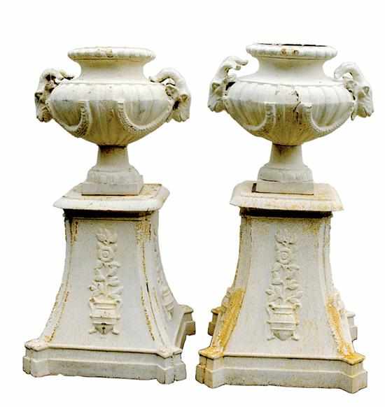 Appraisal: Pair cast-iron garden urns on pedestals bulbous urns flanked by