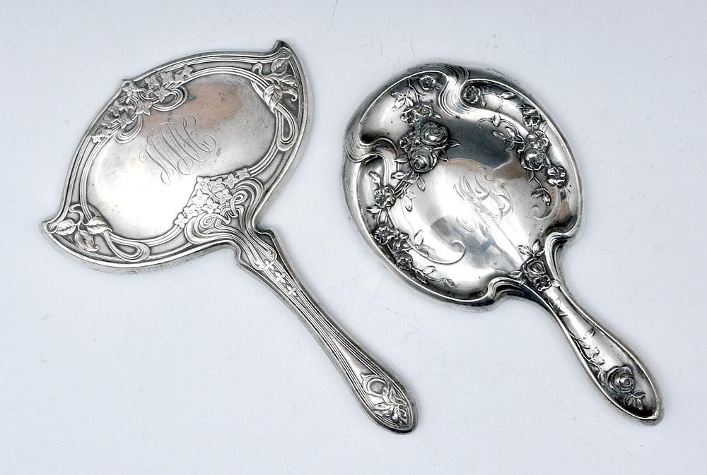 Appraisal: Two sterling silver art nouveau hand mirrors Two sterling silver